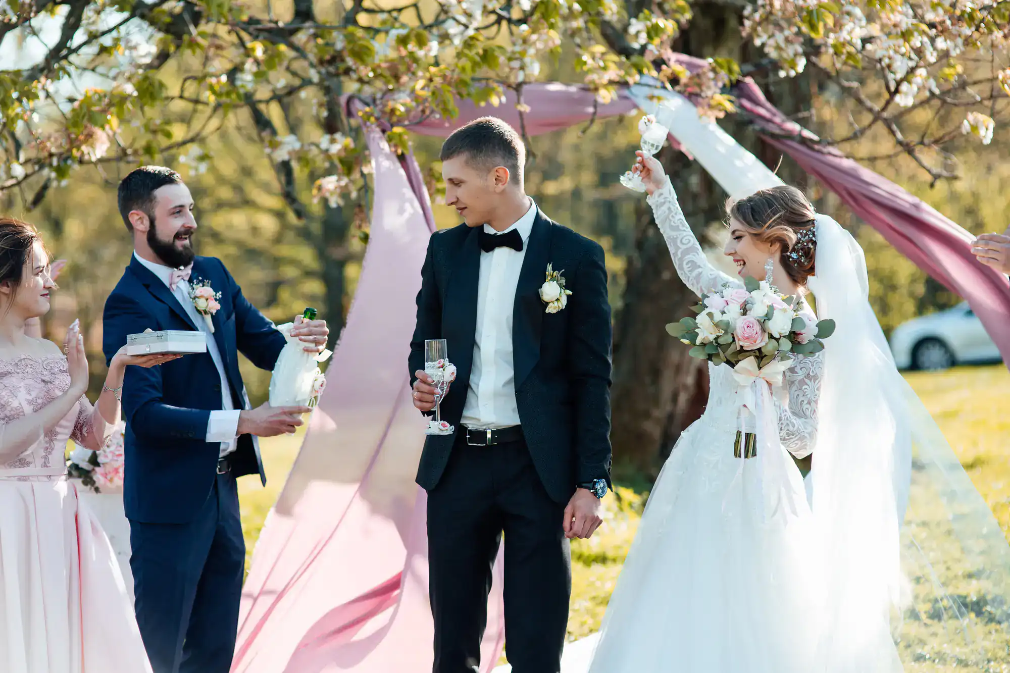 Bride and groom celebrate outdoors with friends while a wedding DJ sets the perfect mood in Minnesota.