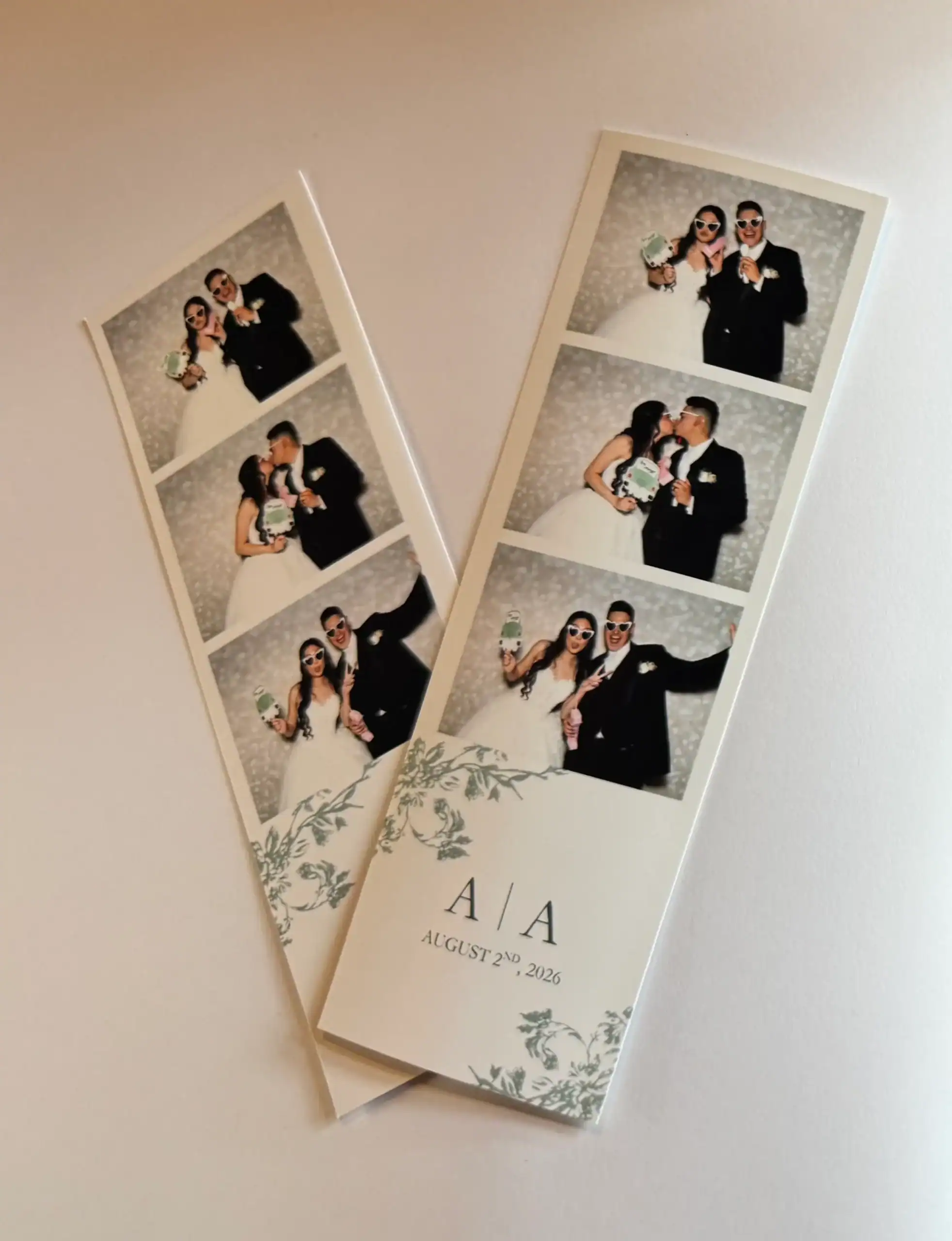 Two photo booth strips show a bride and groom on their wedding day, labeled &ldquo;A A, August 2nd, 2026.&rdquo;